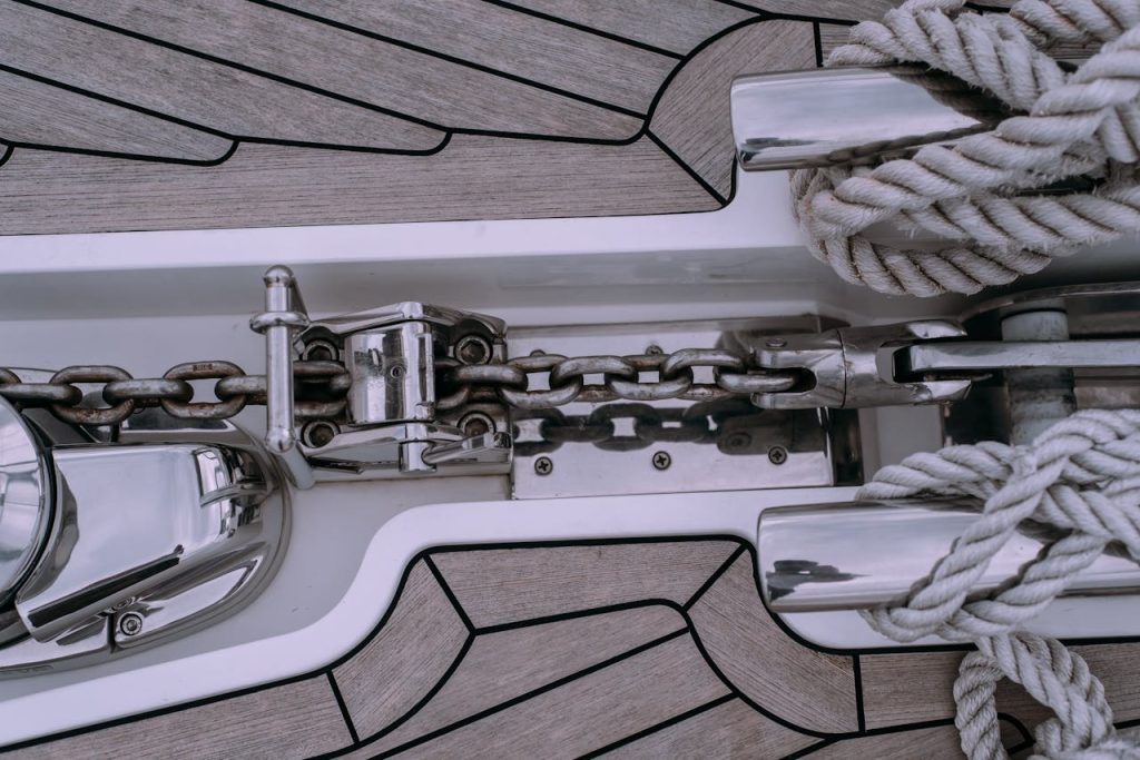 pexels photo 8356419 Detailed shot of sailboat deck featuring a chain and rope setup, ideal for marine themes.